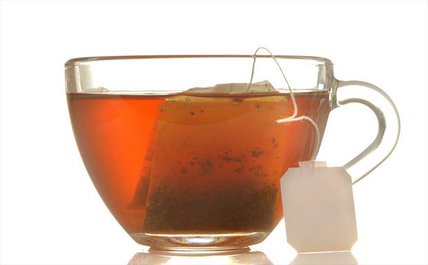 glass cup with tea and tea bag