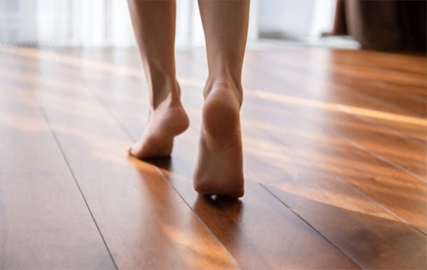 Laminate is quieter and warmer to walk on