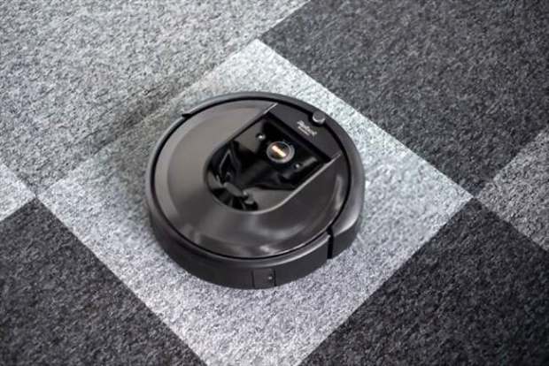 A picture of an iRobot Roomba on the background