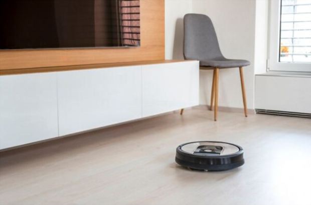 A picture of an automated Roomba in the background