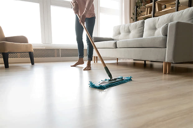 cleaning floor with wet mop