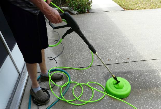 Hover the surface cleaner across the driveway