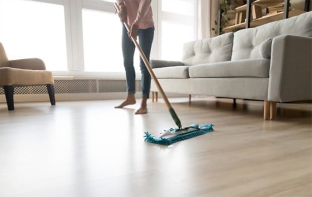 cleaning floor with wet mop pad