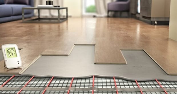 Process of laying laminate panels on floor with underfloor heating