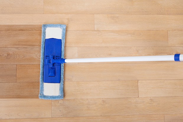 Mop hardwood floors with the cleaning solution
