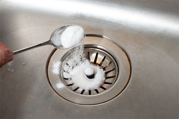 Add baking soda then lemon to clean your drains