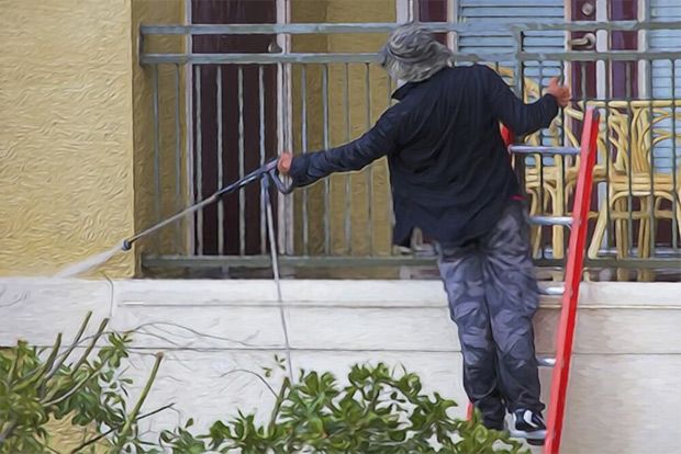 Don’t pressure-wash while on a ladder, like this man