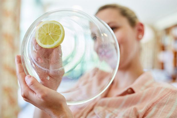 Use lemon to scrub off the stains and smudges on your glass