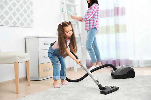 Using vacuum cleaner in room