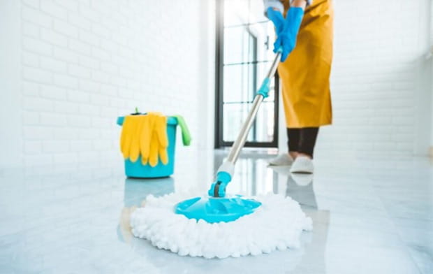 using a mop while cleaning floor