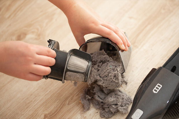 Clean the vacuum regularly and empty the dust cup to make the vacuum smell better