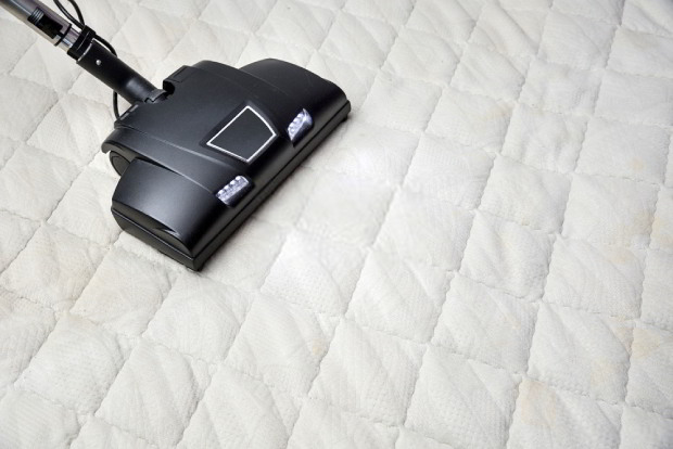 Use a vacuum cleaner to sanitize your beddings