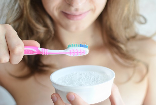Use baking soda to brush your teeth